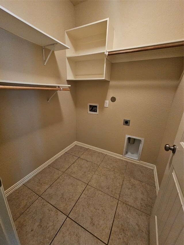 23122 Biddle Dr, Porter, TX 77365 - washroom with hookup for an electric dryer, washer hookup, tile patterned floors, baseboards, and gas dryer hookup