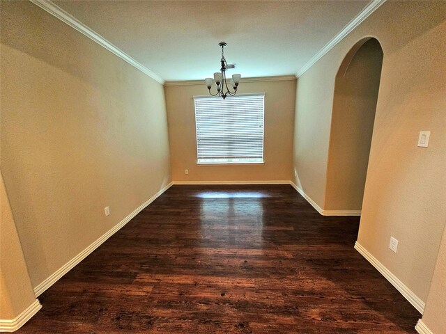 23122 Biddle Dr, Porter, TX 77365 - empty room with a chandelier, ornamental molding, dark wood-type flooring, arched walkways, and baseboards
