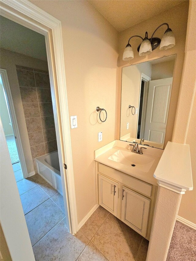 23122 Biddle Dr, Porter, TX 77365 - bathroom featuring tile patterned floors, vanity, baseboards, and shower / washtub combination