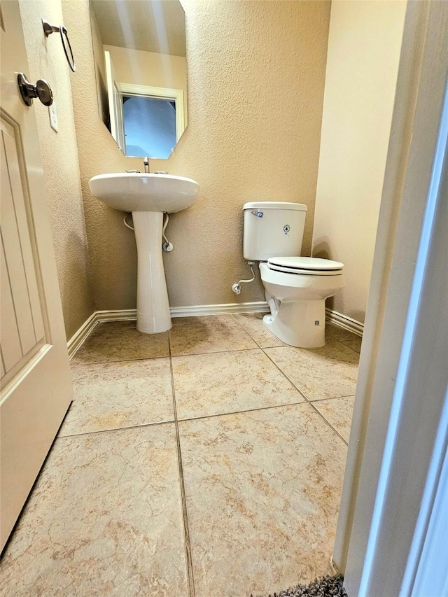 23122 Biddle Dr, Porter, TX 77365 - half bath with toilet, tile patterned floors, and baseboards
