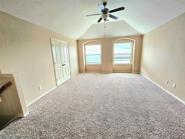 23122 Biddle Dr, Porter, TX 77365 - unfurnished living room featuring ceiling fan, carpet flooring, lofted ceiling, a textured wall, and baseboards