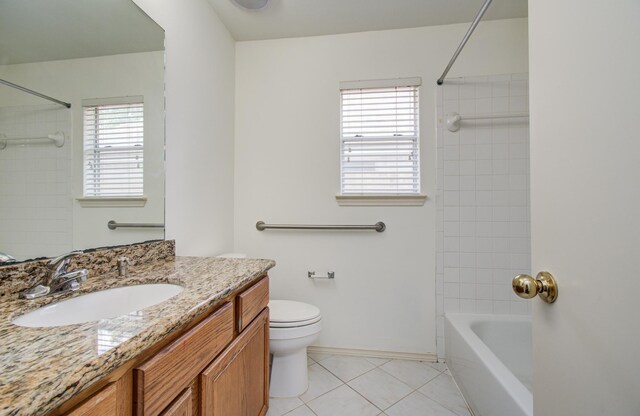 3359 Tenaha Dr, Houston, TX 77014 - full bath featuring toilet, vanity, tile patterned flooring, and healthy amount of natural light