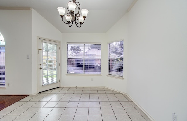 3359 Tenaha Dr, Houston, TX 77014 - unfurnished dining area featuring lofted ceiling, a chandelier, and baseboards