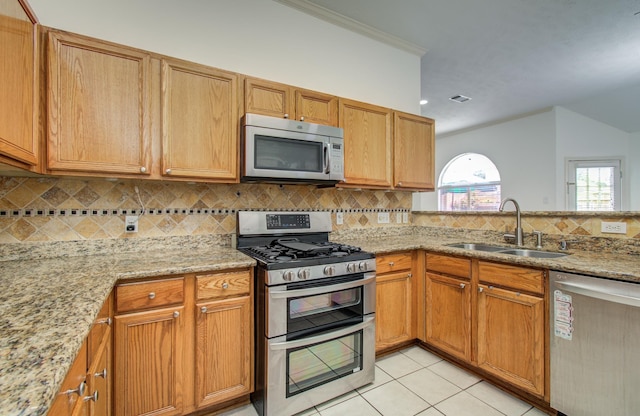 3359 Tenaha Dr, Houston, TX 77014 - kitchen featuring appliances with stainless steel finishes, a sink, light tile patterned flooring, backsplash, and light stone counters