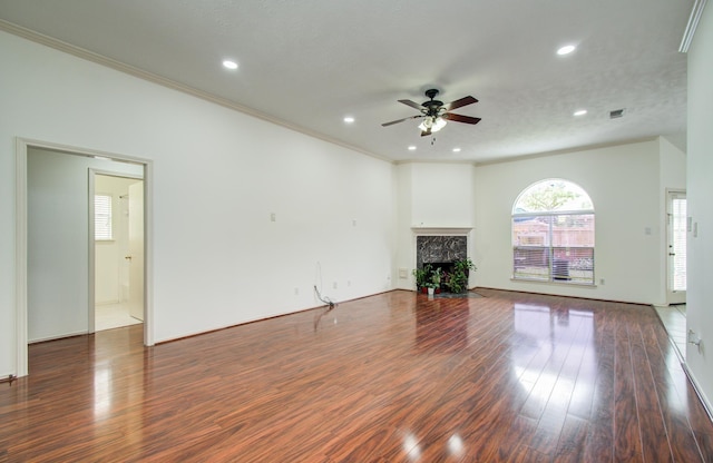 3359 Tenaha Dr, Houston, TX 77014 - unfurnished living room with ceiling fan, wood finished floors, a fireplace with flush hearth, recessed lighting, and crown molding