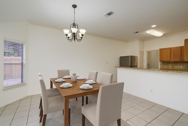 3359 Tenaha Dr, Houston, TX 77014 - dining space with ornamental molding, a chandelier, light tile patterned floors, and recessed lighting