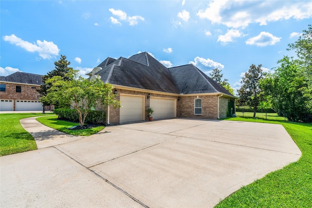 2509 Creektrail Ln, Richmond, TX 77406 - view of front of home with brick siding, a garage, and driveway