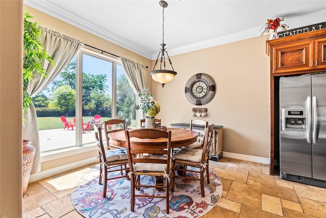 2509 Creektrail Ln, Richmond, TX 77406 - dining area with stone tile floors, crown molding, and baseboards