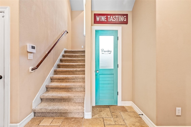 2509 Creektrail Ln, Richmond, TX 77406 - stairway featuring stone tile floors and baseboards
