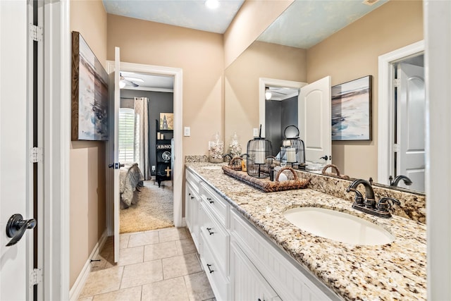 2509 Creektrail Ln, Richmond, TX 77406 - full bath featuring connected bathroom, double vanity, tile patterned floors, and baseboards