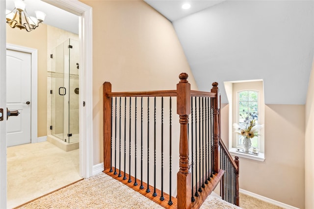 2509 Creektrail Ln, Richmond, TX 77406 - stairway featuring a chandelier, baseboards, and vaulted ceiling