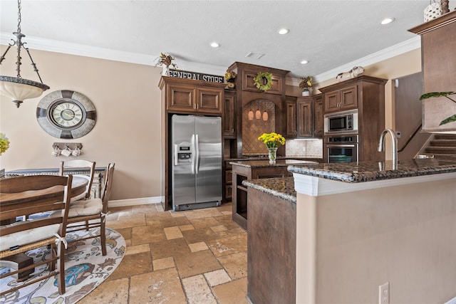 2509 Creektrail Ln, Richmond, TX 77406 - kitchen with appliances with stainless steel finishes, stone tile floors, ornamental molding, tasteful backsplash, and baseboards
