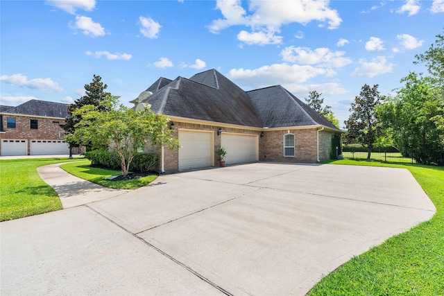 2509 Creektrail Ln, Richmond, TX 77406 - view of front of house featuring brick siding, a garage, concrete driveway, and a shingled roof