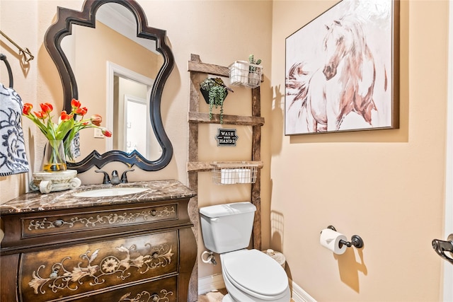 2509 Creektrail Ln, Richmond, TX 77406 - bathroom with toilet, vanity, and baseboards
