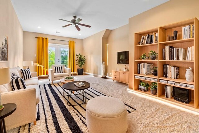 2509 Creektrail Ln, Richmond, TX 77406 - sitting room featuring french doors, a ceiling fan, carpet, and baseboards