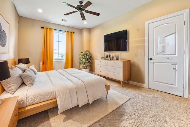 2509 Creektrail Ln, Richmond, TX 77406 - bedroom with light colored carpet, a ceiling fan, and recessed lighting