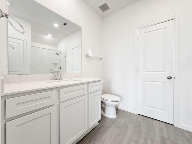 5667 Foggy Vine Ct, Fulshear, TX 77441 - bathroom with a tile shower, toilet, vanity, recessed lighting, and baseboards