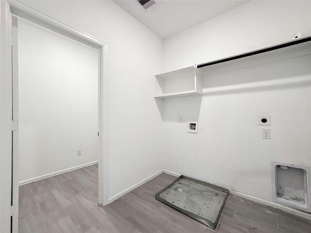 5667 Foggy Vine Ct, Fulshear, TX 77441 - laundry room with electric dryer hookup, wood finished floors, and hookup for a washing machine