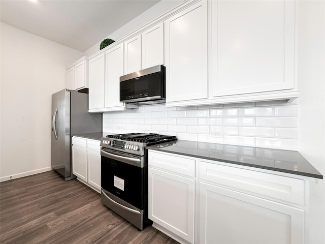 5667 Foggy Vine Ct, Fulshear, TX 77441 - kitchen featuring stainless steel appliances, dark wood-style floors, tasteful backsplash, white cabinets, and baseboards
