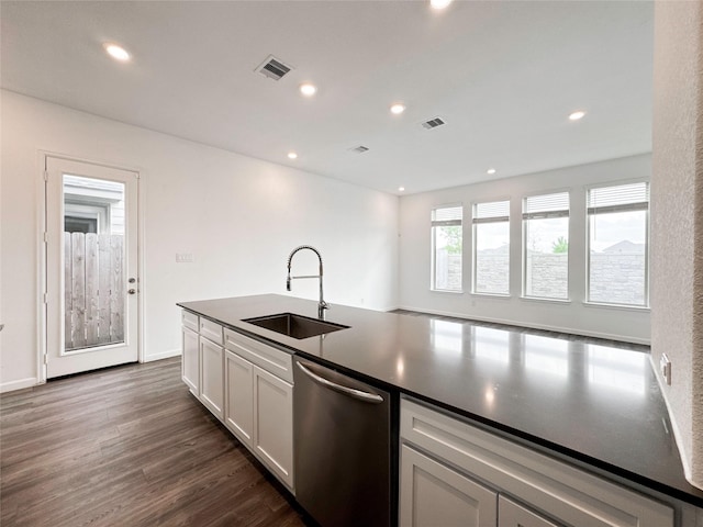 5667 Foggy Vine Ct, Fulshear, TX 77441 - kitchen with dishwasher, a sink, dark countertops, dark wood finished floors, and recessed lighting