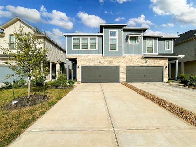 5667 Foggy Vine Ct, Fulshear, TX 77441 - view of front of property featuring driveway, a garage, and stone siding