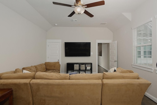2205 Salt Grass Trl, Conroe, TX 77384 - living room with ceiling fan, vaulted ceiling, baseboards, and dark wood finished floors