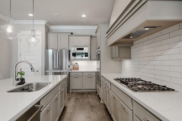 2205 Salt Grass Trl, Conroe, TX 77384 - kitchen with custom exhaust hood, stainless steel appliances, a sink, ornamental molding, and backsplash