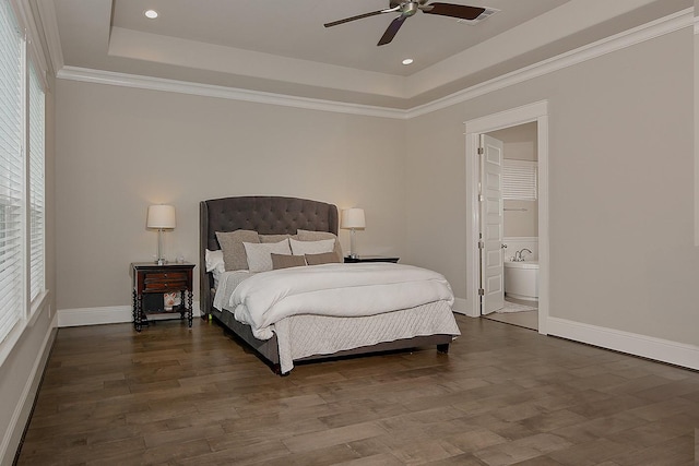 2205 Salt Grass Trl, Conroe, TX 77384 - bedroom featuring a raised ceiling, multiple windows, baseboards, recessed lighting, and ornamental molding