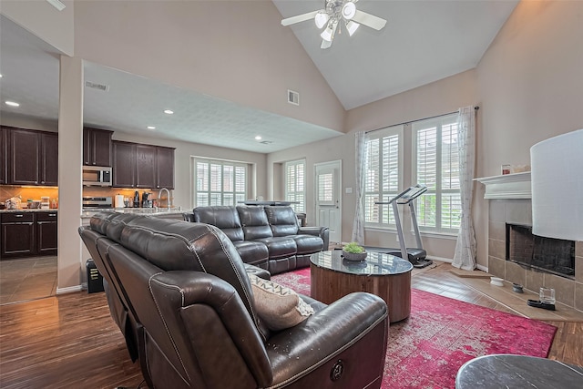 24623 Forest Hiker Ct, Katy, TX 77493 - living area featuring ceiling fan, a fireplace, wood finished floors, recessed lighting, and high vaulted ceiling