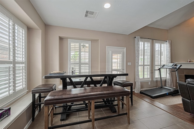24623 Forest Hiker Ct, Katy, TX 77493 - tiled dining space featuring plenty of natural light and baseboards