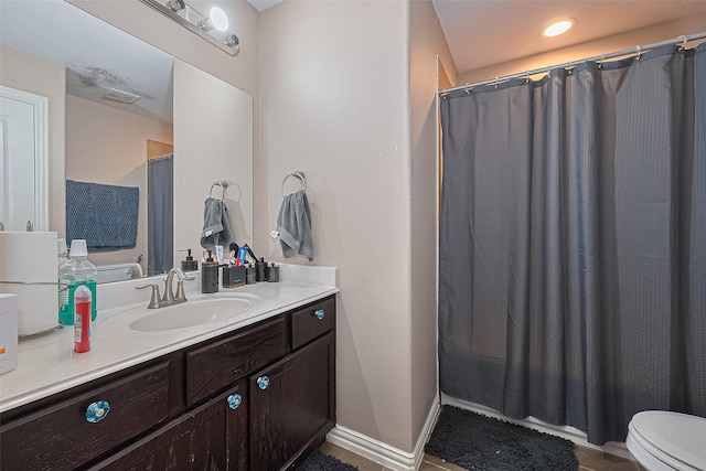 24623 Forest Hiker Ct, Katy, TX 77493 - full bathroom with vanity, toilet, curtained shower, and baseboards