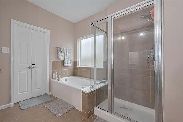 24623 Forest Hiker Ct, Katy, TX 77493 - bathroom with a shower stall, a bath, and tile patterned flooring