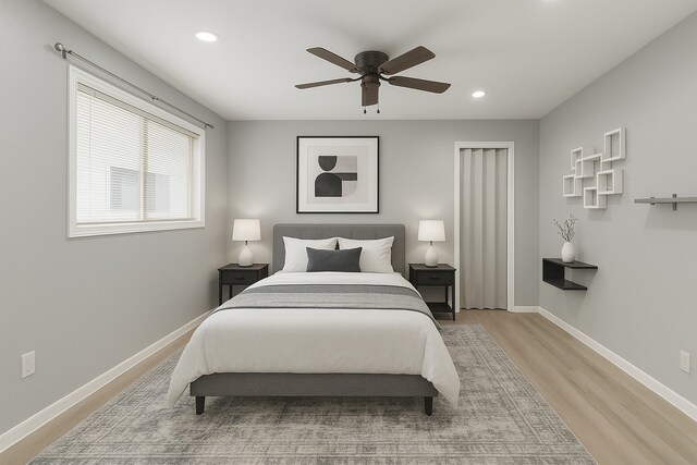 1509 Chestnut Ln, Richmond, TX 77469 - bedroom with light wood-type flooring, recessed lighting, and ceiling fan