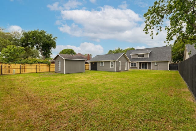 1509 Chestnut Ln, Richmond, TX 77469 - back of house featuring a fenced backyard and a storage shed