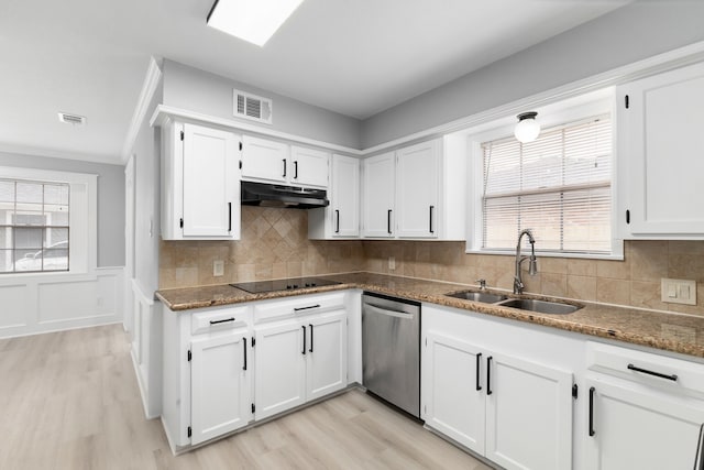 1509 Chestnut Ln, Richmond, TX 77469 - kitchen featuring stainless steel dishwasher, under cabinet range hood, black electric cooktop, light wood finished floors, and wainscoting