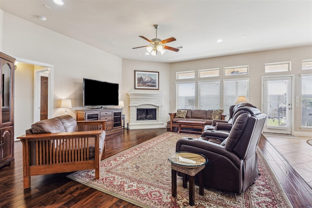 28915 Davenport Dr, Katy, TX 77494 - living area featuring ceiling fan, healthy amount of natural light, dark wood-style flooring, a fireplace with raised hearth, and recessed lighting
