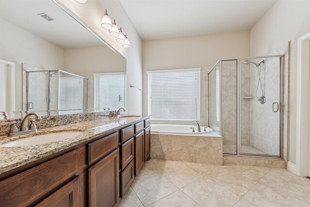28915 Davenport Dr, Katy, TX 77494 - bathroom with a bath, tile patterned floors, a stall shower, and double vanity