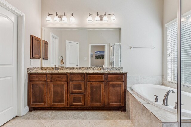 28915 Davenport Dr, Katy, TX 77494 - bathroom with a bath, double vanity, plenty of natural light, and a stall shower