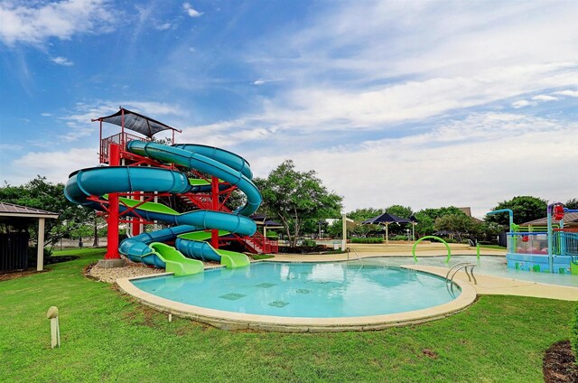 28915 Davenport Dr, Katy, TX 77494 - view of pool featuring a yard and a water slide