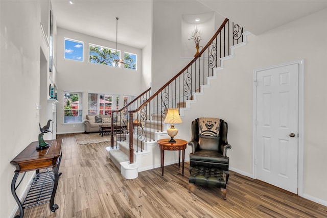 6406 Pine Reserve Dr, Spring, TX 77389 - entryway with plenty of natural light, a high ceiling, stairs, and wood finished floors