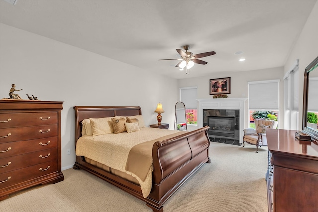 6406 Pine Reserve Dr, Spring, TX 77389 - bedroom with light colored carpet, a tiled fireplace, recessed lighting, and a ceiling fan