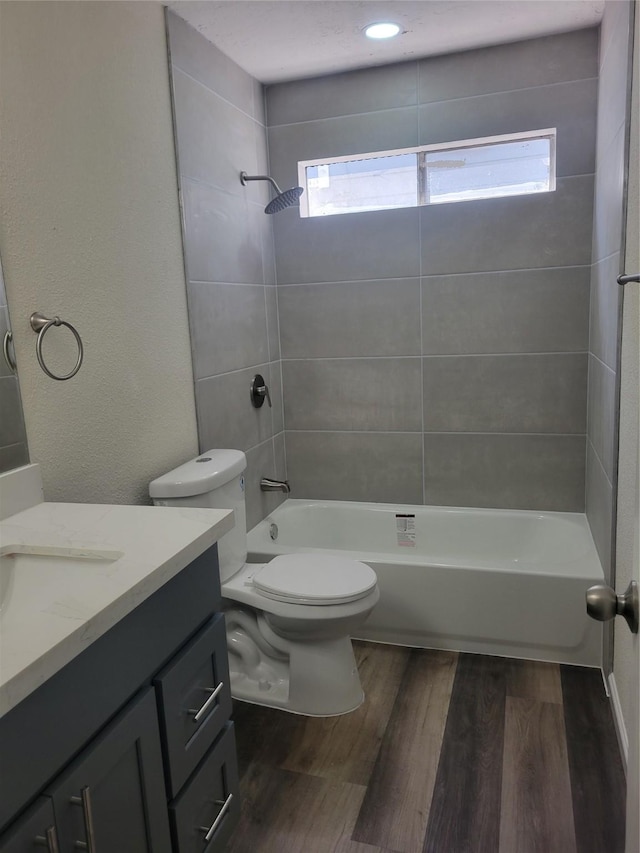 11544 Springshire Dr, Houston, TX 77066 - bathroom with vanity, toilet, bathtub / shower combination, wood finished floors, and plenty of natural light