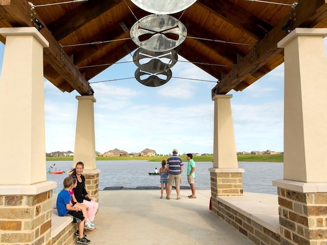 12522 Nueces River Dr, Cypress, TX 77433 - covered porch with a water view and ceiling fan