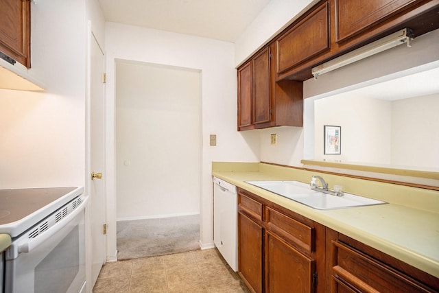 215 Postoffice St Unit 508, Galveston, TX 77550 - kitchen with a sink, white appliances, light colored carpet, light countertops, and baseboards