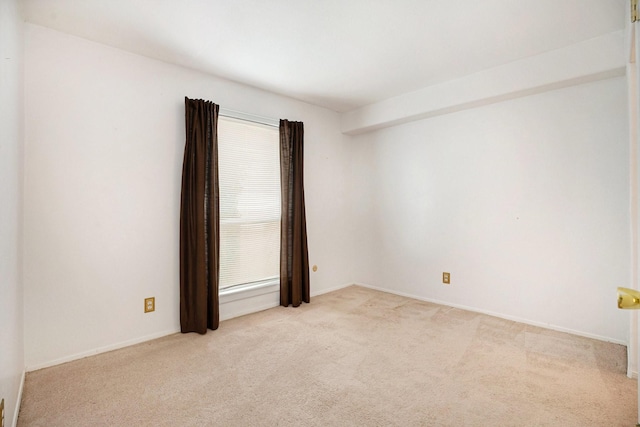 215 Postoffice St Unit 508, Galveston, TX 77550 - spare room featuring light colored carpet and baseboards