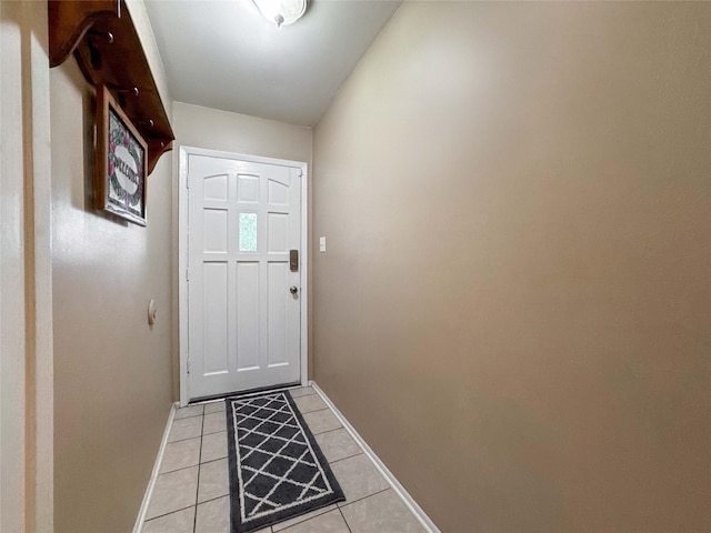 720 E Murray St, Angleton, TX 77515 - doorway with baseboards and light tile patterned flooring