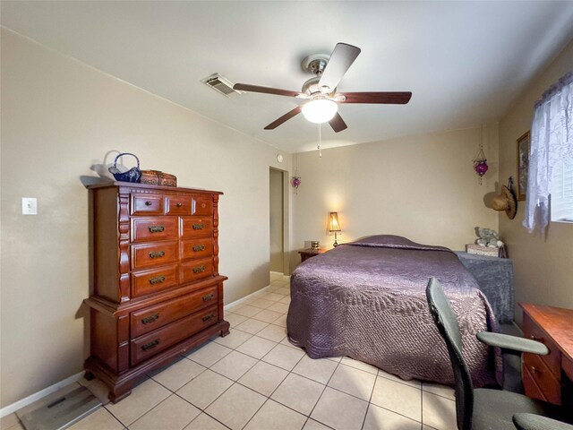 720 E Murray St, Angleton, TX 77515 - bedroom with light tile patterned flooring and ceiling fan