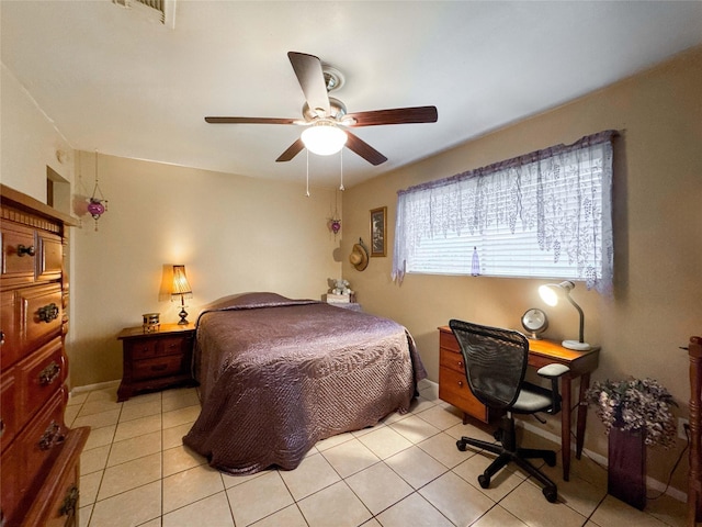 720 E Murray St, Angleton, TX 77515 - bedroom featuring light tile patterned floors, a ceiling fan, and baseboards