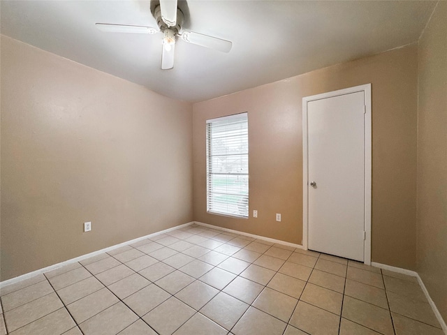 720 E Murray St, Angleton, TX 77515 - unfurnished room featuring light tile patterned floors, a ceiling fan, and baseboards