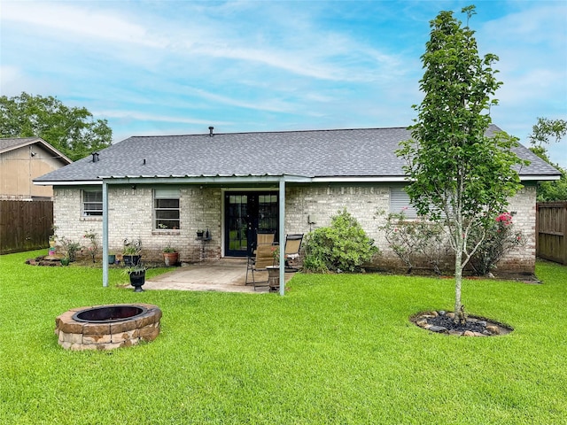 720 E Murray St, Angleton, TX 77515 - back of house featuring french doors, an outdoor fire pit, a patio area, brick siding, and a shingled roof